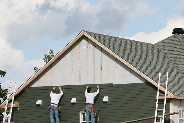 Professional Storm Damage Siding Repair technician working in West Salisbury, PA